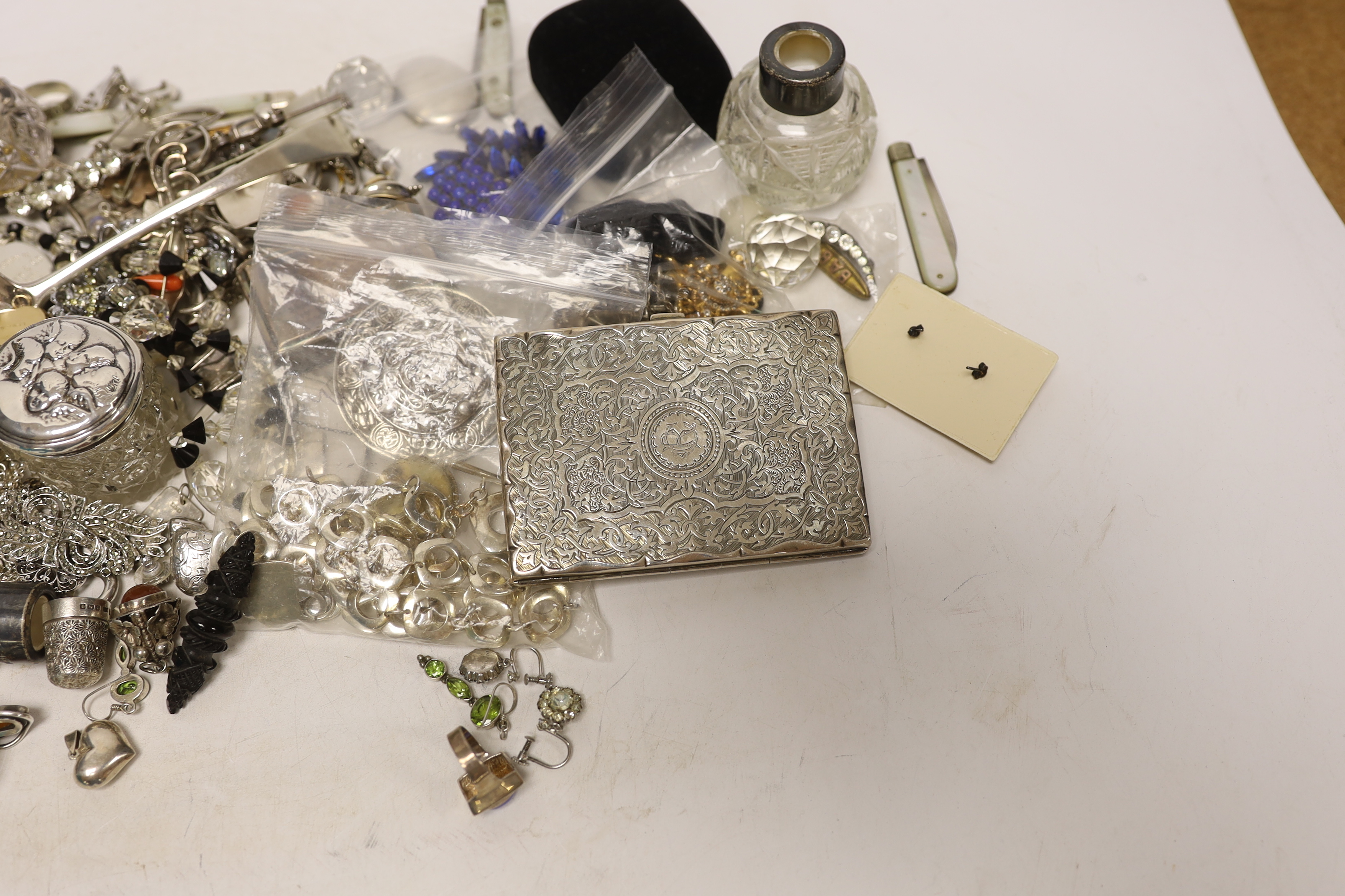 A group of assorted silver and jewellery, including a 19th century snuff box, sifter spoon and card case, a later toilet jar, scent bottle and sovereign case, necklaces, earrings and lockets including white metal and oth